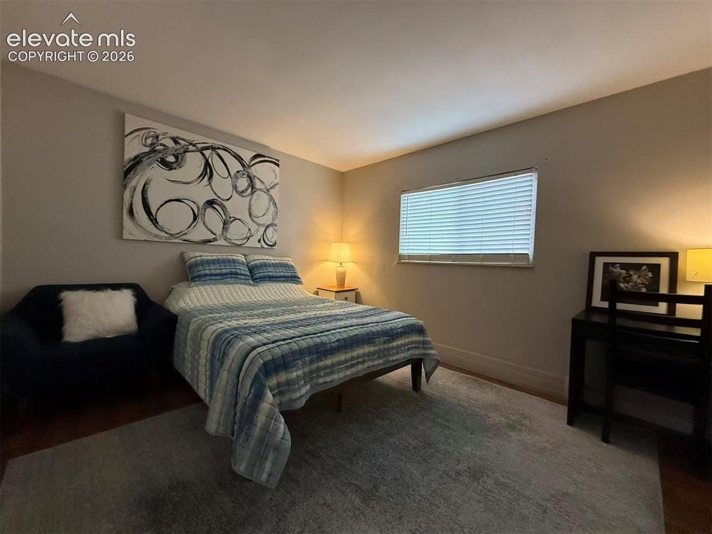 Warm neutral wall tones with window blinds