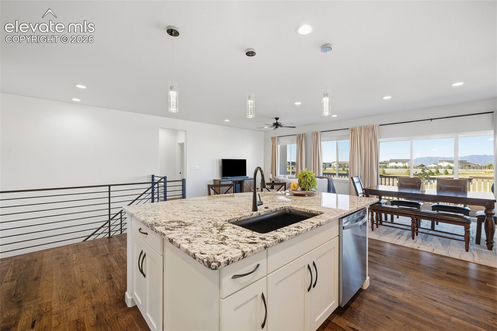 The oversized island features storage AND seating and overlooks the dining and living spaces, keeping the main floor connected. Imagine the sunset views from the kitchen!