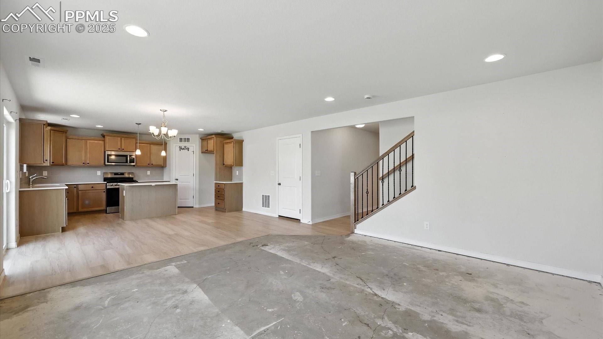 View of the Dining Area and Kitchen from the Living Room.