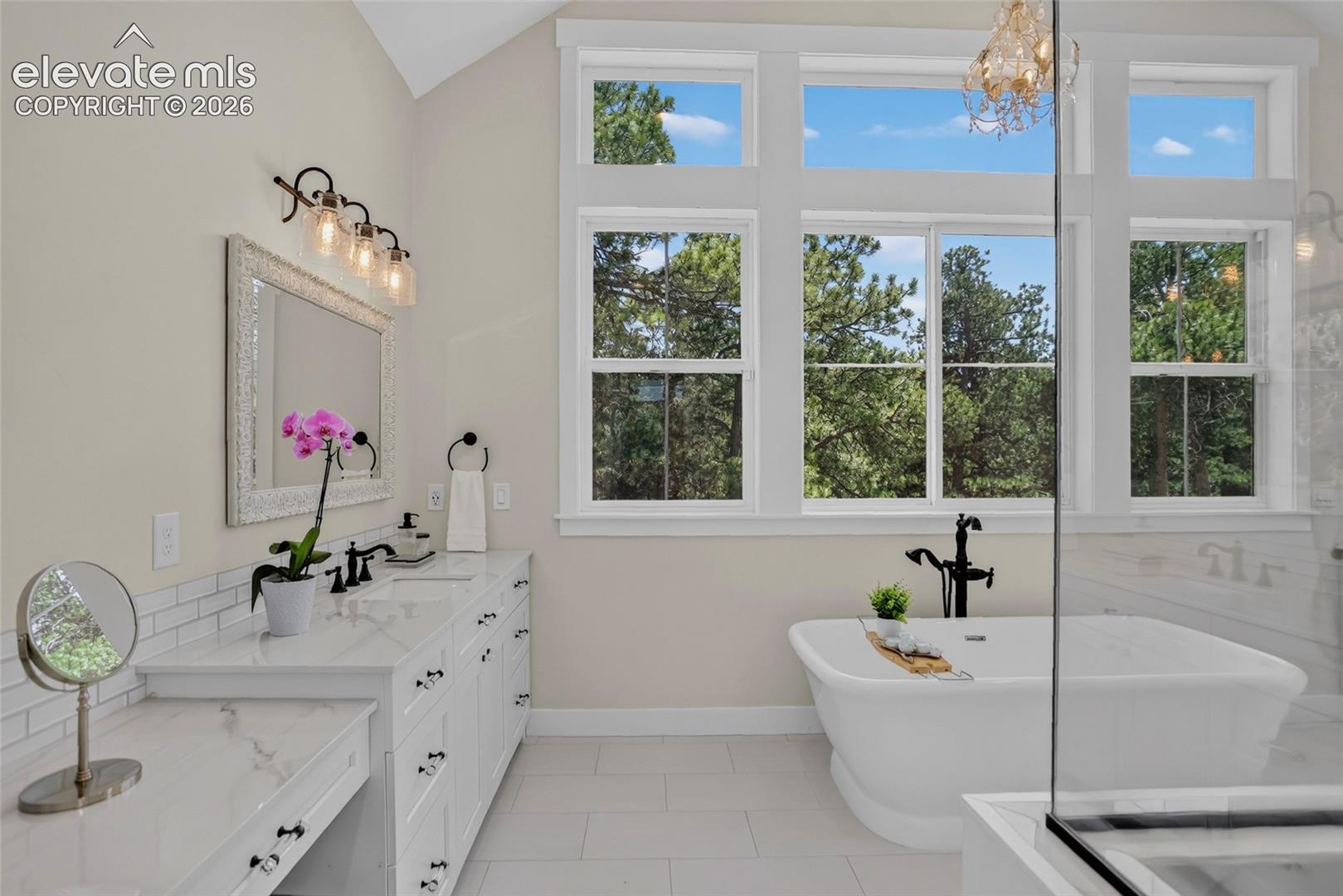 Primary bath w/ separate vanities & makeup vanity