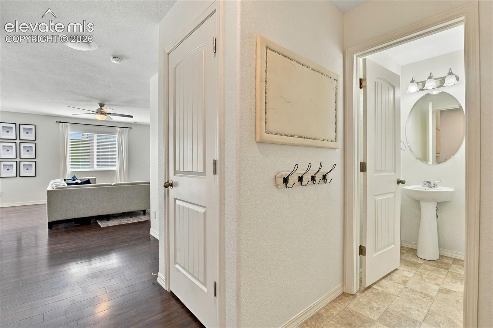 Hardwood-finish flooring, ceiling fan, and panel doors