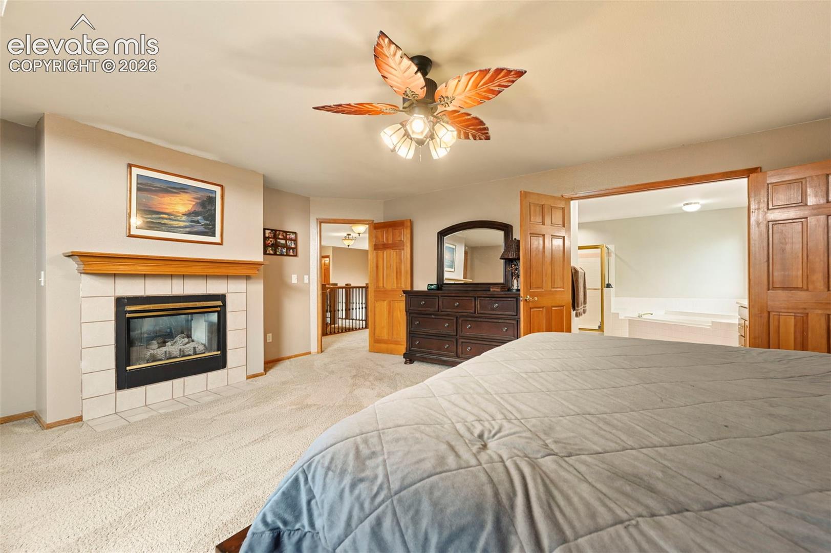 Fireplace with tile surround and wood mantel