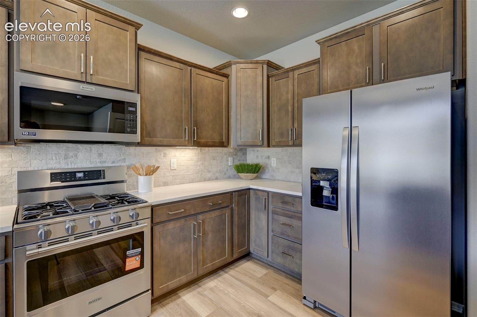 gas range, microwave, refrigerator and dishwasher included