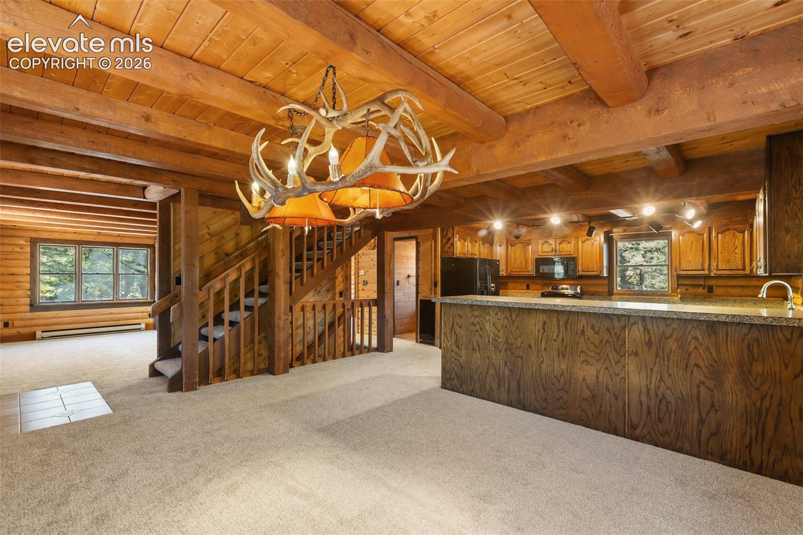 Custom antler chandelier in dining area.