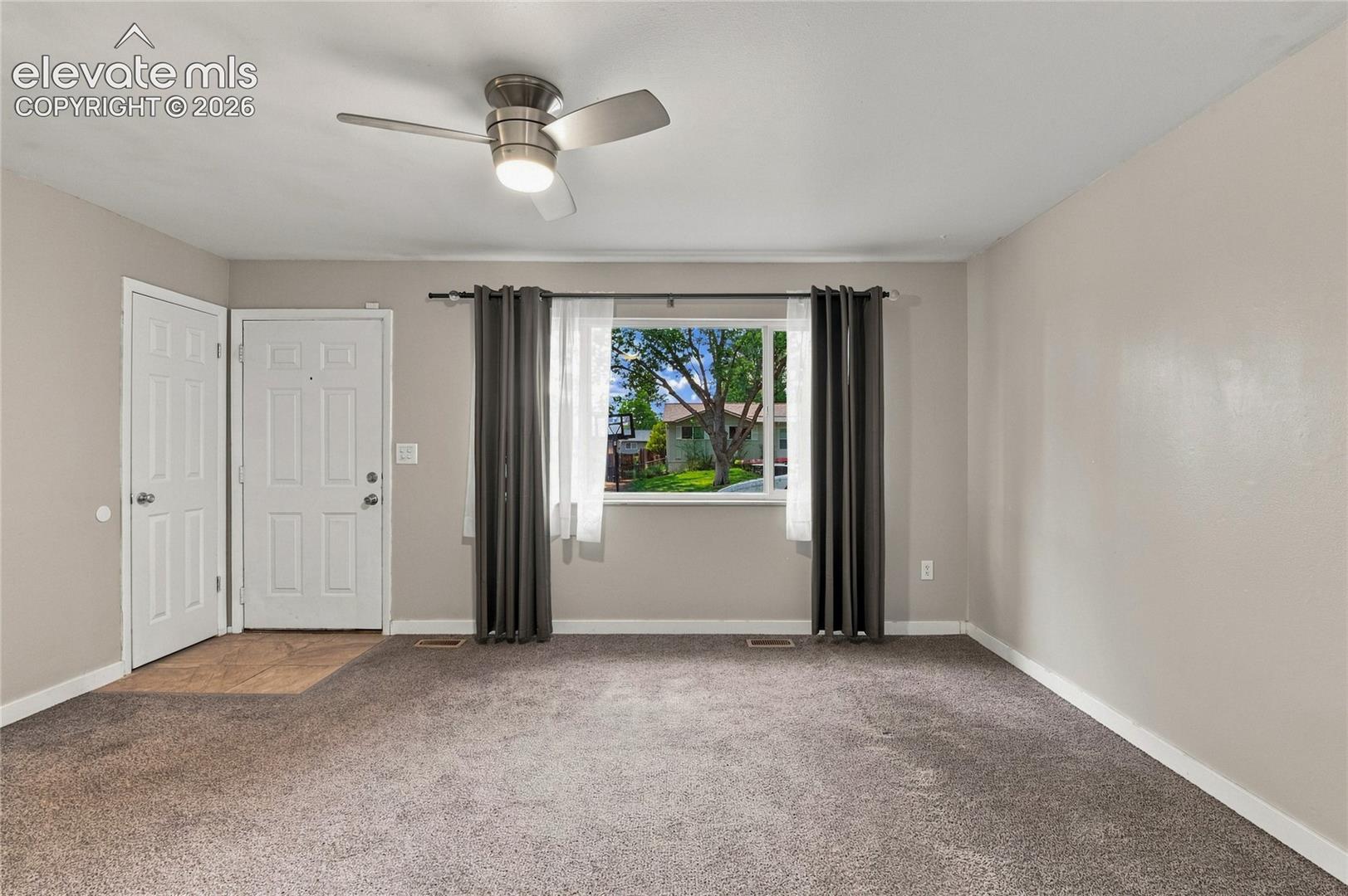 Front entrance and coat closet in living room