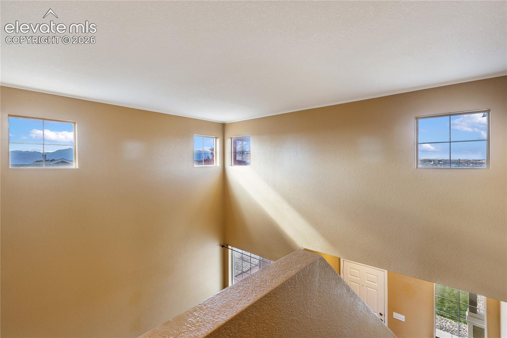 Beautiful high windows give home tons of natural light and elegance.