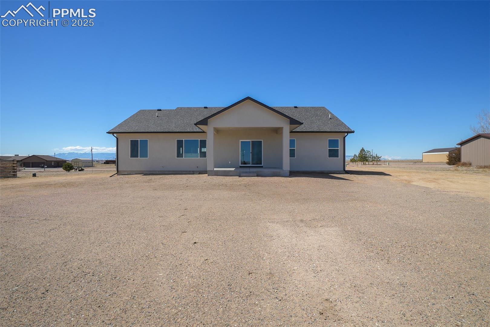 View of front of property with an outdoor structure