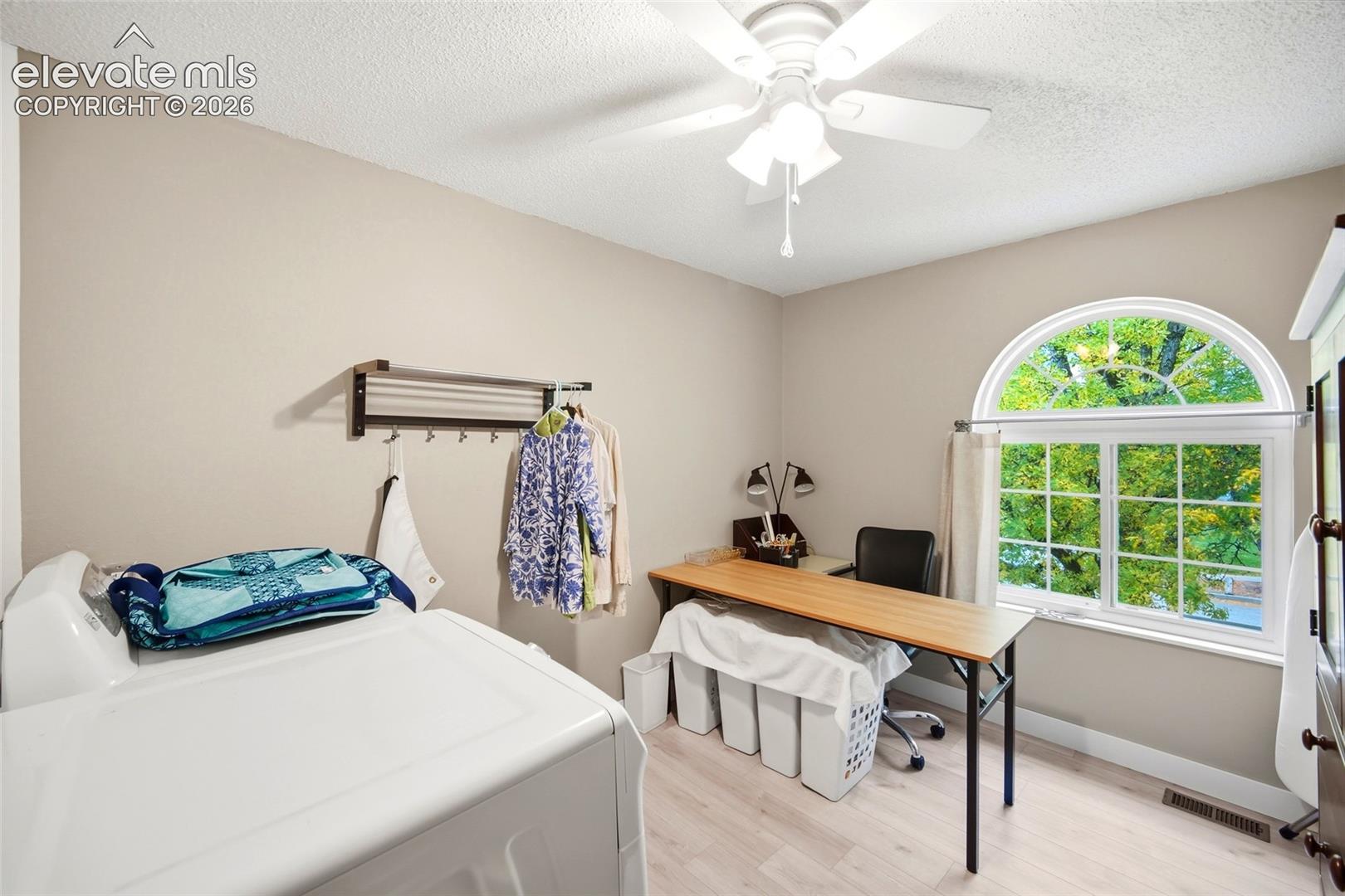 Laundry room converted from an upper level bedroom.