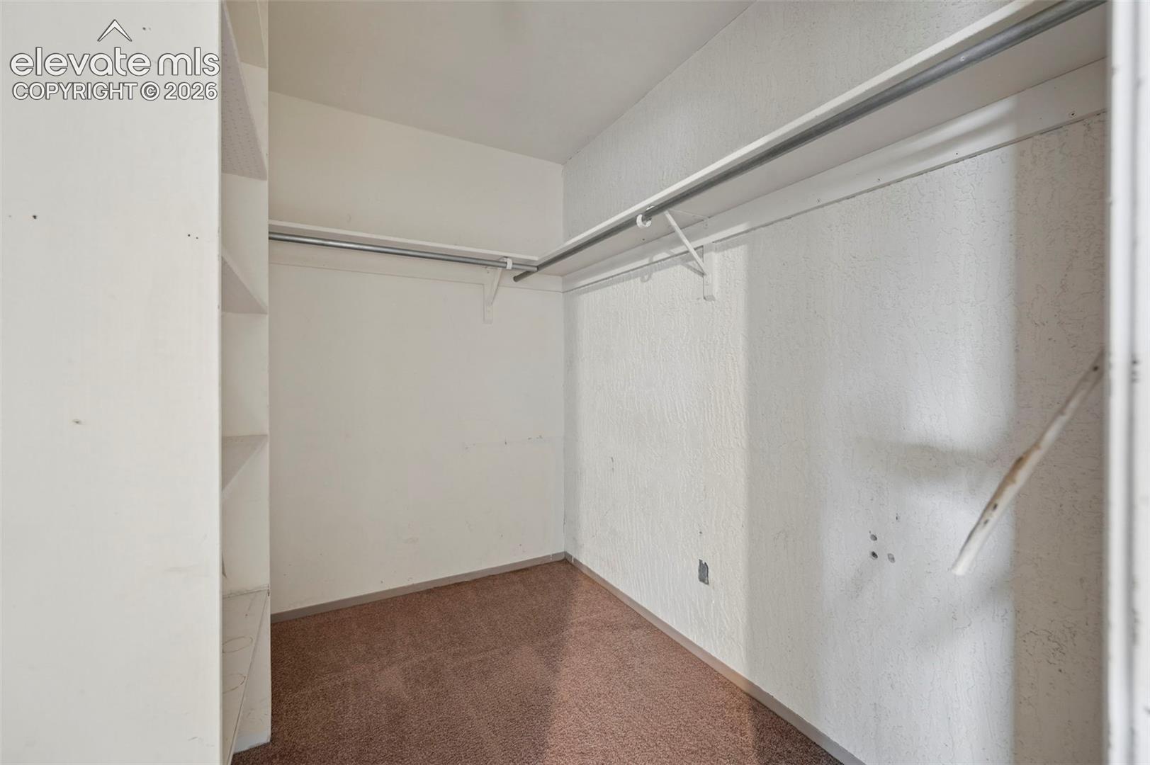 Integrated shelving unit and dual clothing rods