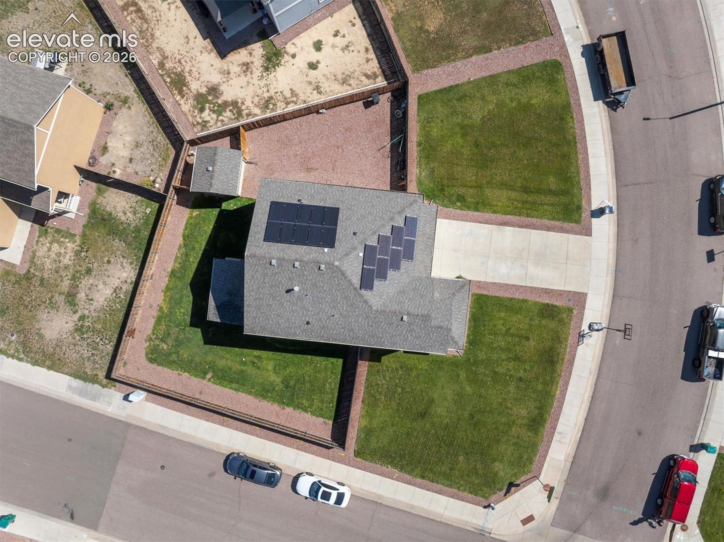 Asphalt shingle roof with multiple solar panel arrays