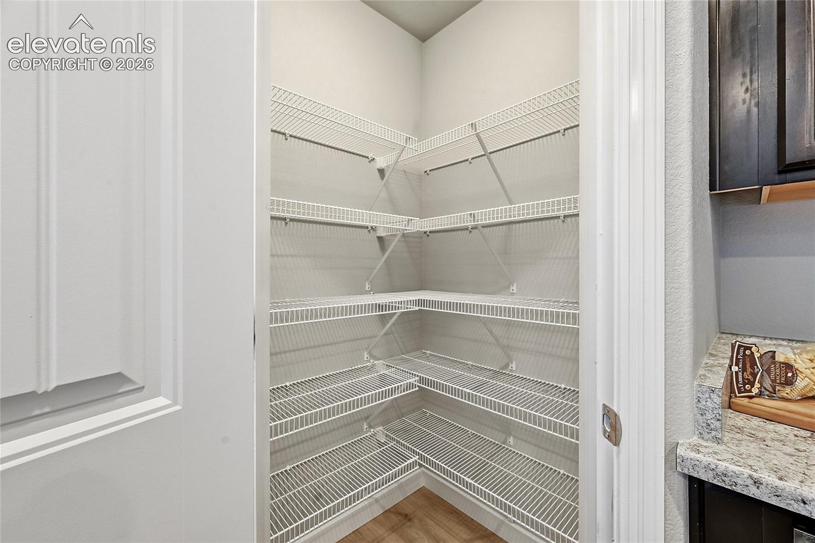Pantry with extensive wire shelving, offering multiple levels of storage