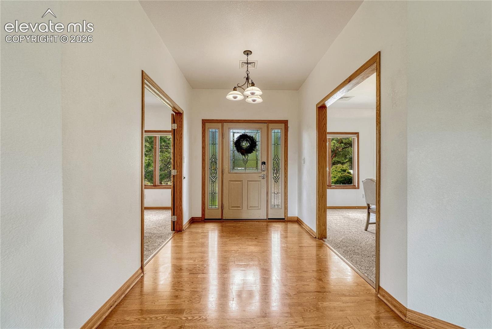 Back inside:  hardwood flooring continues through the entry, kitchen and great room.