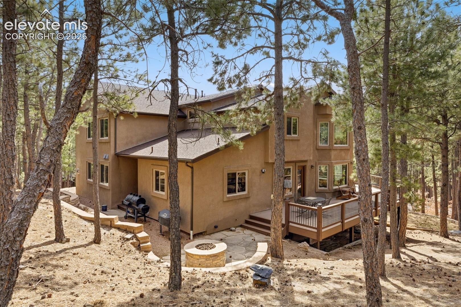 Back of property showing gas firepit