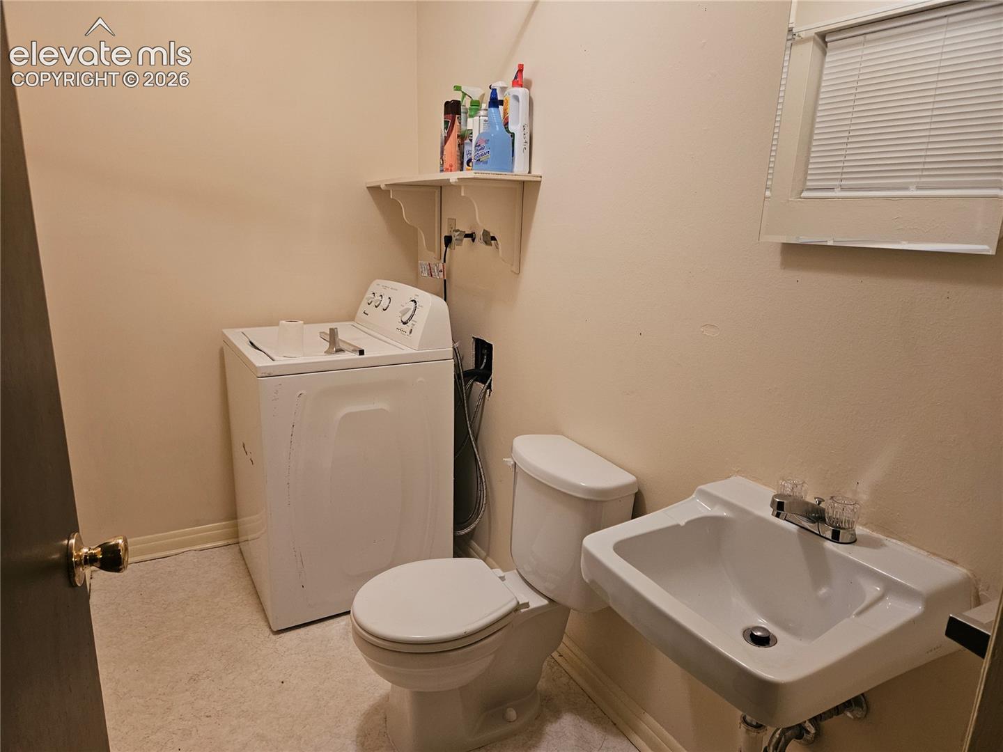 1/2 Bath, out of the Bonus Room.  Clothes washer setup in this bathroom.