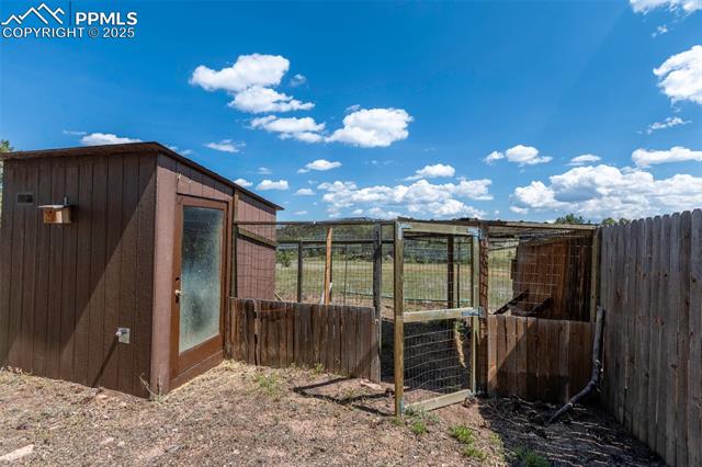 Enclosed chicken coop with attached enclosed chicken run.