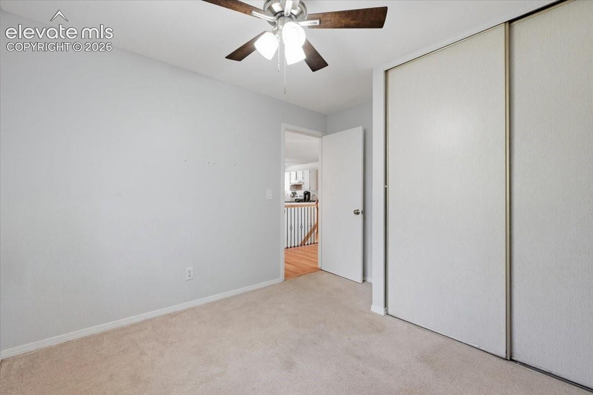Main level bedroom 1 - Closets feature multiple shelves. 