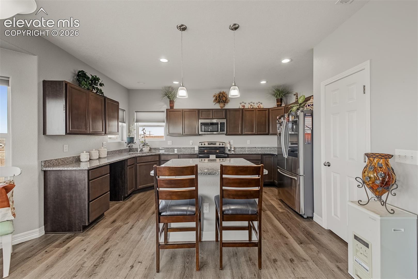 Kitchen featuring a large pantry for extra storage. 