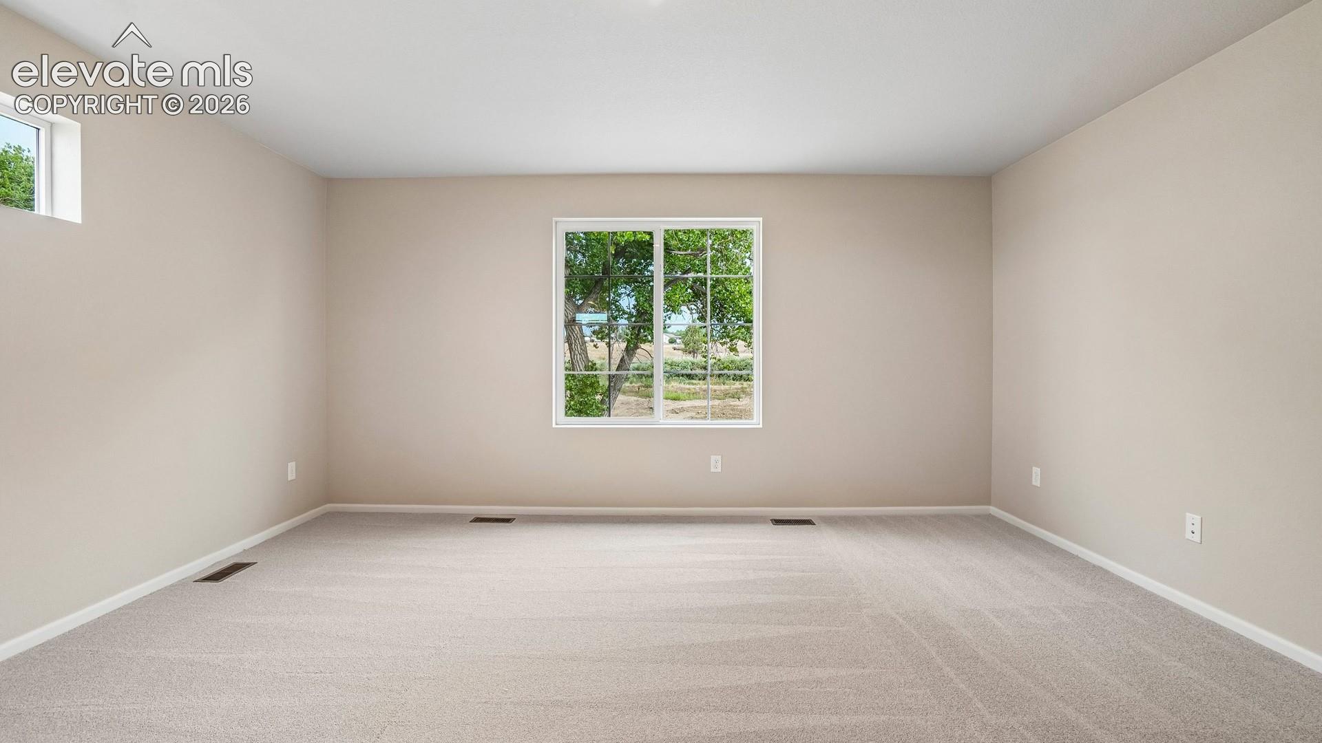 Plush carpet flooring, neutral-toned walls, and a white trim finish
*photos of a model home*
