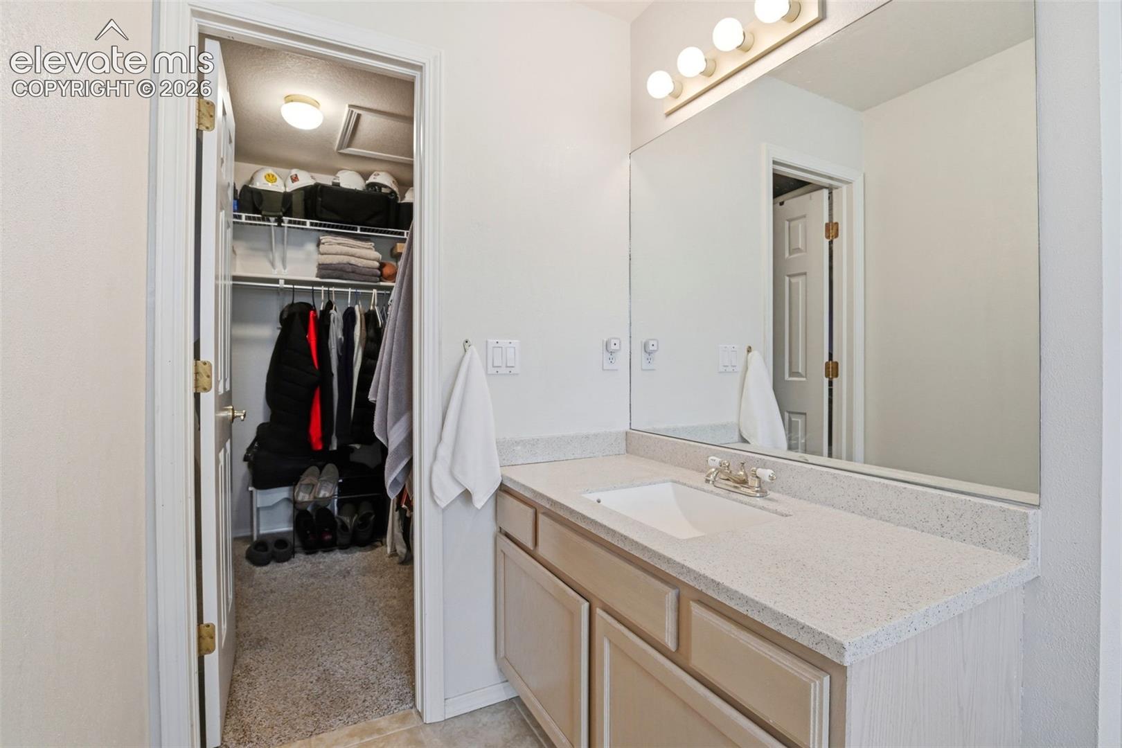 Second separate vanity leads to the walk in closet