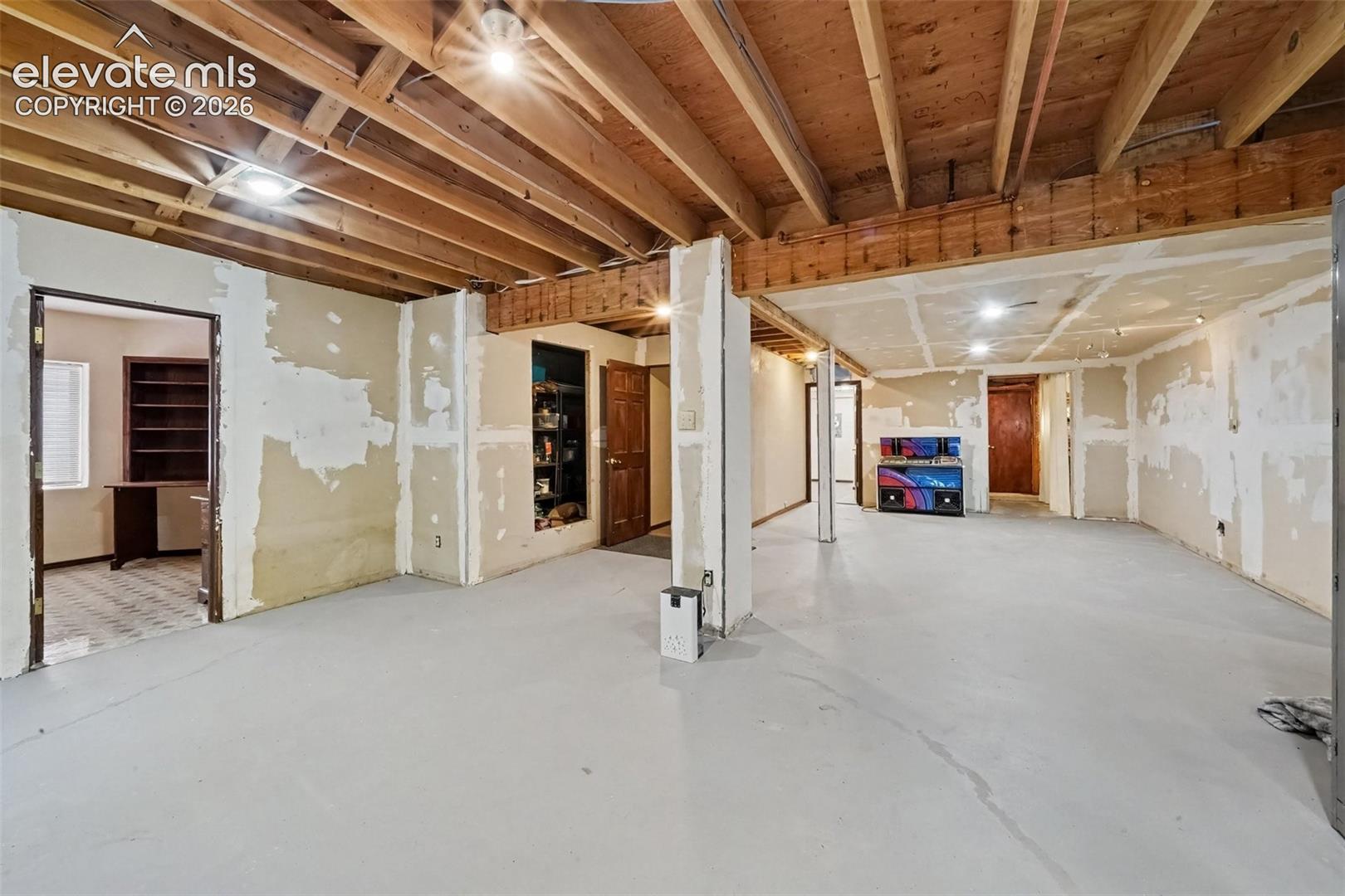 Spacious basement area offers versatile space for recreation, hobbies, storage, and additional living needs