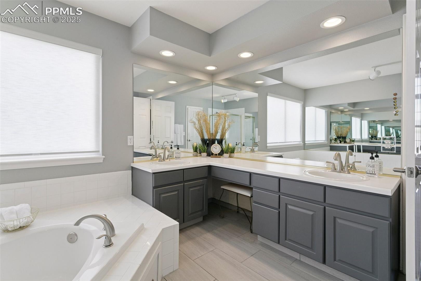 Double vanity with tons of counter space and a bench seat!