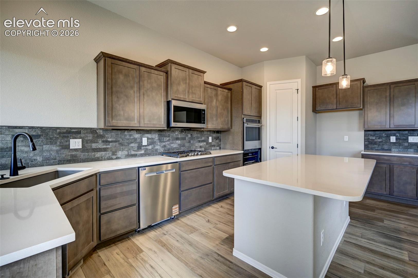 kitchen with view of walk-in pantry door