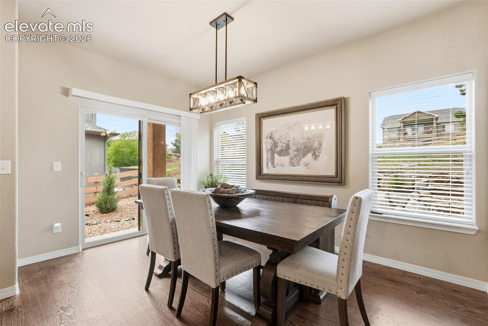 Light and bright dining room with updated light fixture 