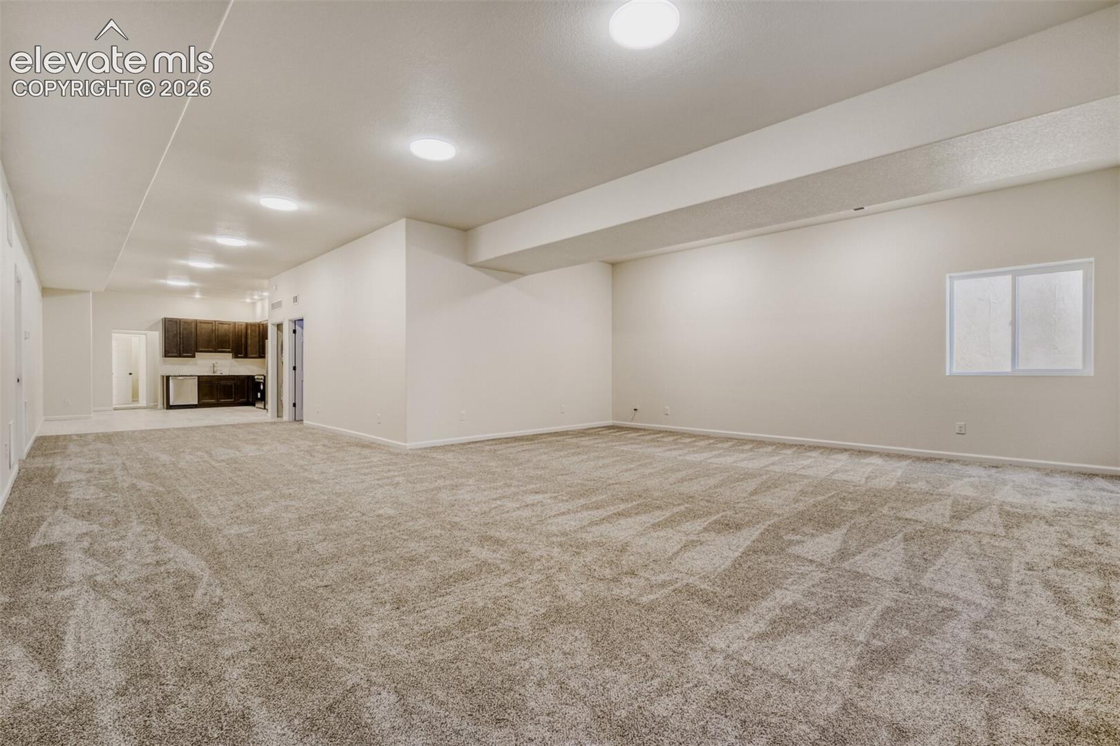 Basement family/game room with kitchenette and second laundry