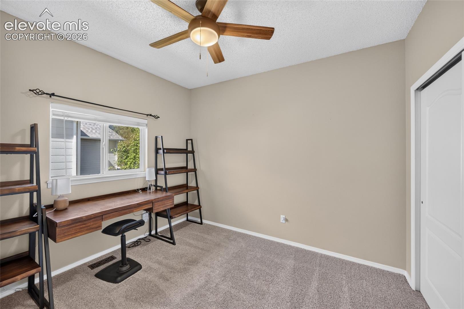 Second main-level bedroom with new ceiling fan