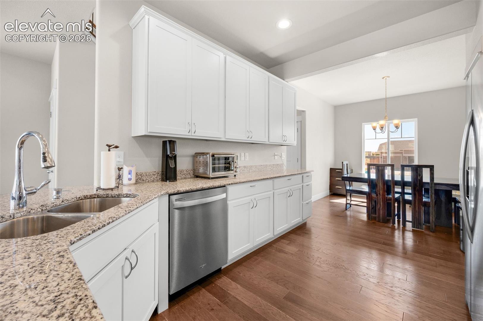 Engineered plank flooring in kitchen and dining area