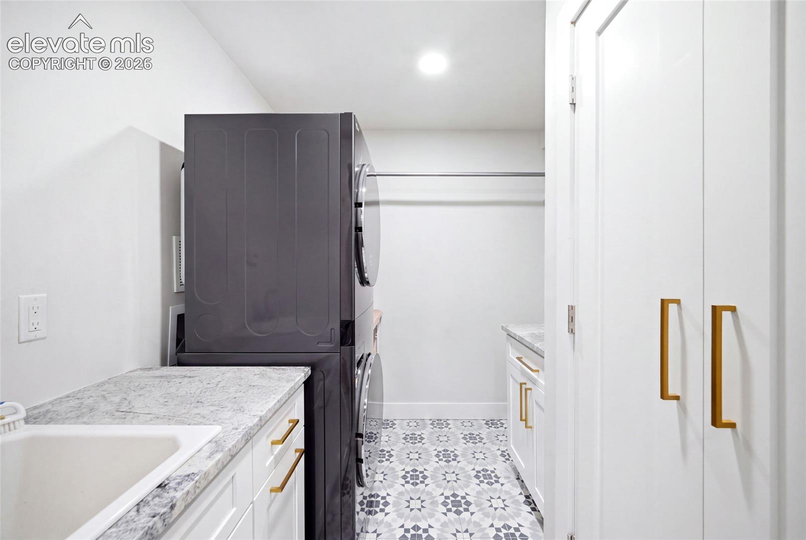 You won't even mind doing laundry in this gorgeous home. The updated laundry room is bright and spacious. 