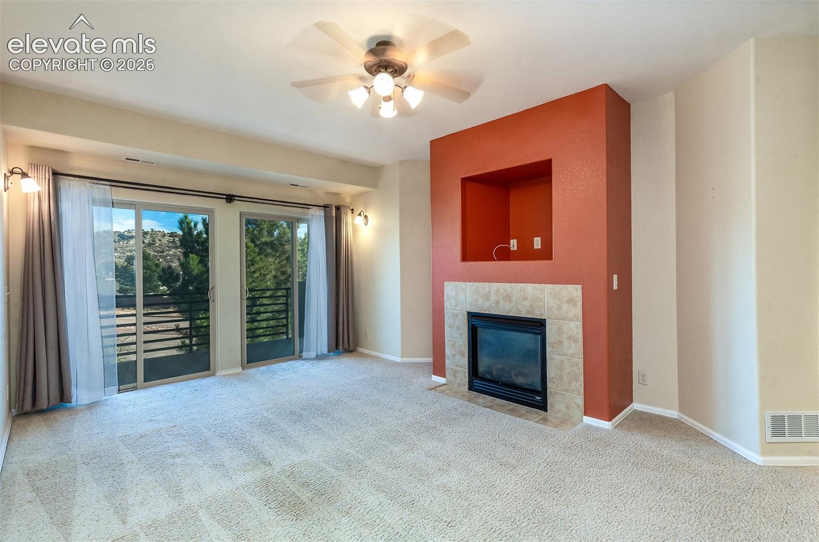 Gas fireplace and walkout to private balcony.