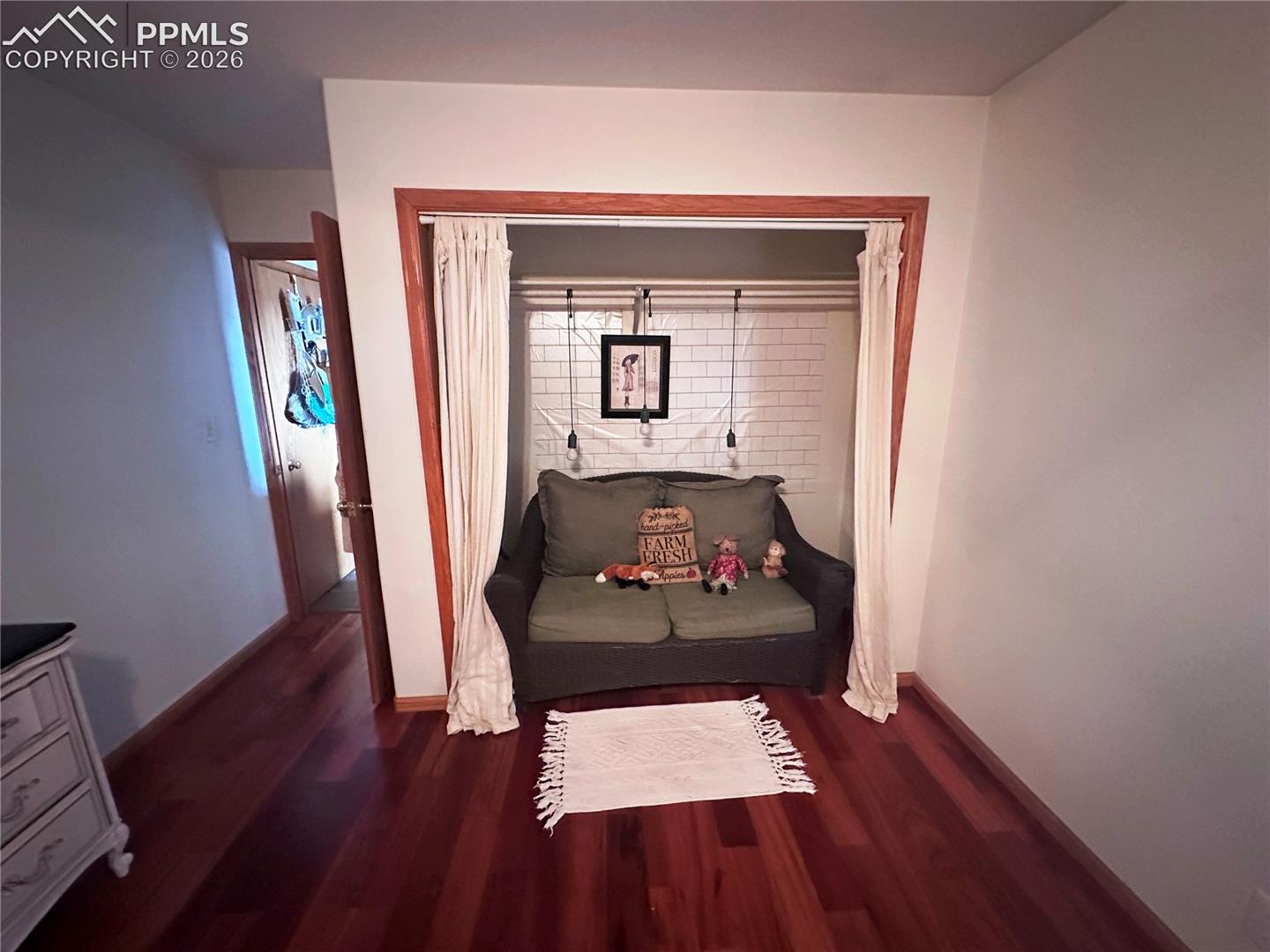 Bedroom 3, with closet presently used as sitting area for visiting overnight guests.