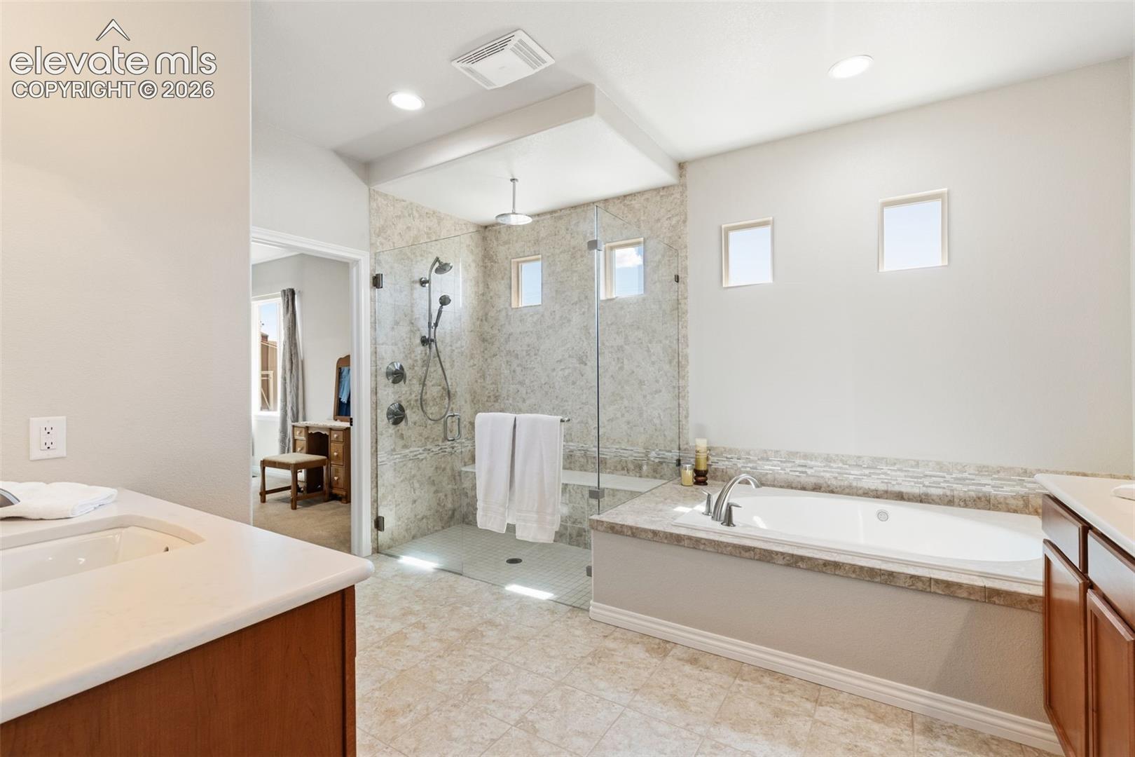 En suite primary 5-piece spa-inspired bathroom