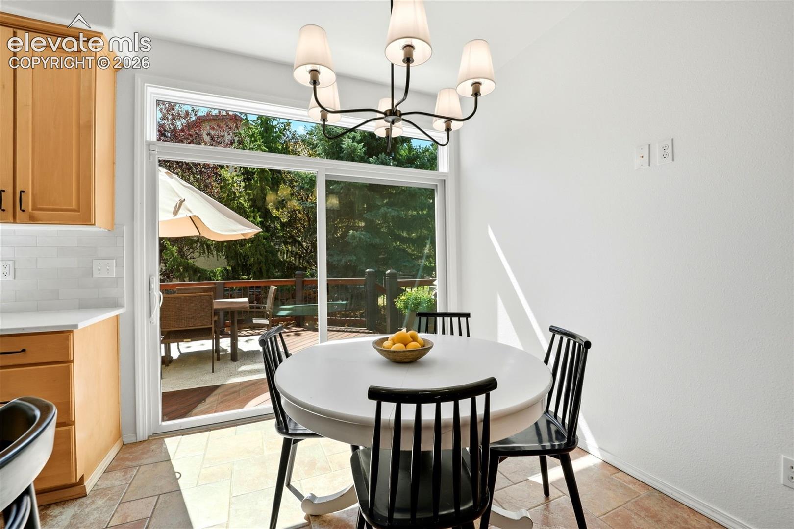 Eat in kitchen with a view of the deck and yard