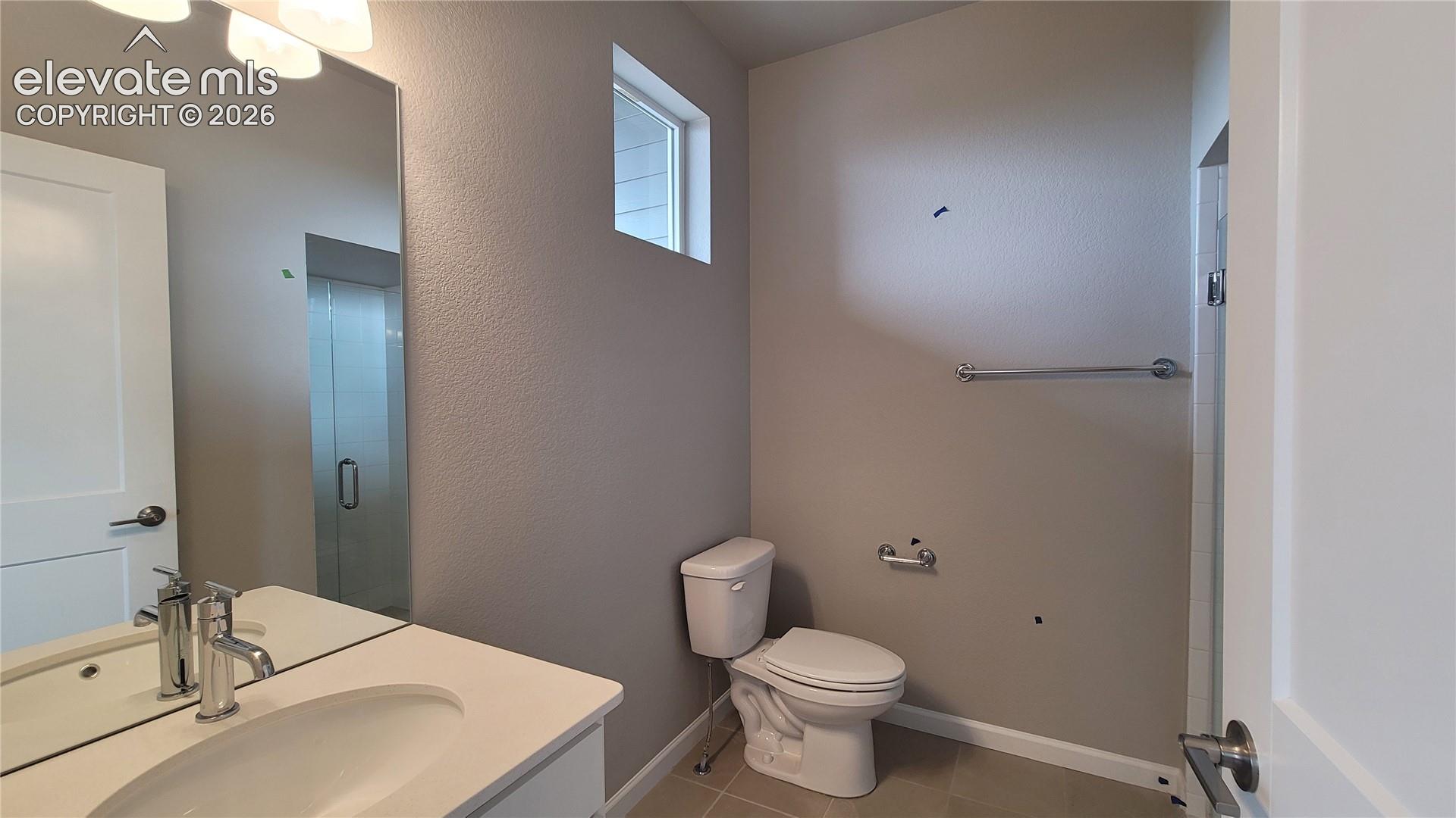 3/4 Bathroom with quartz countertop and tile surrounds!