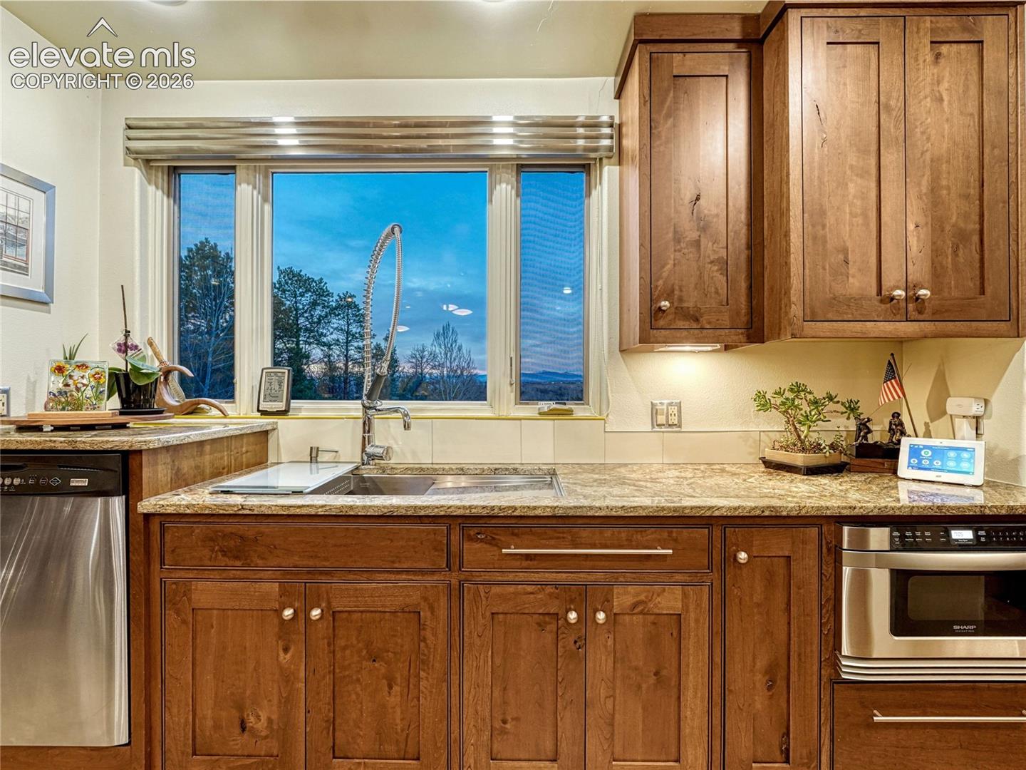 One of two sink/dishwasher/prep spaces.