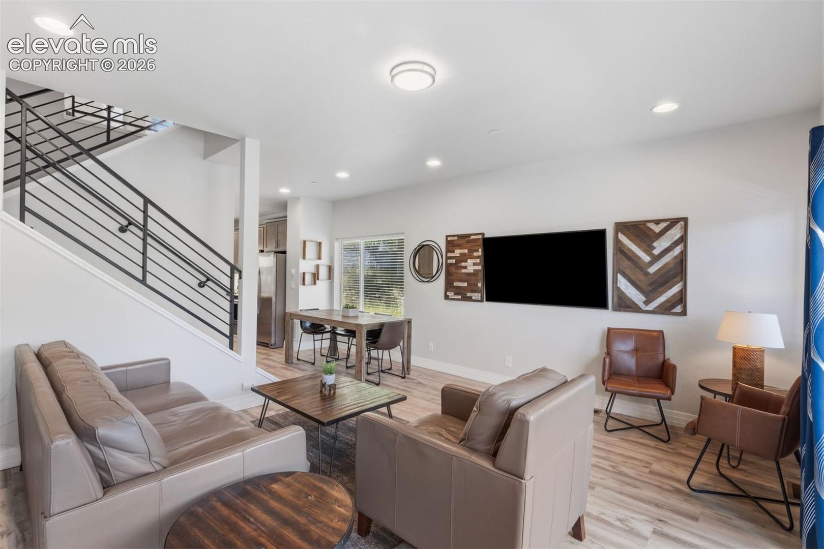 Living room with walkout access to deck