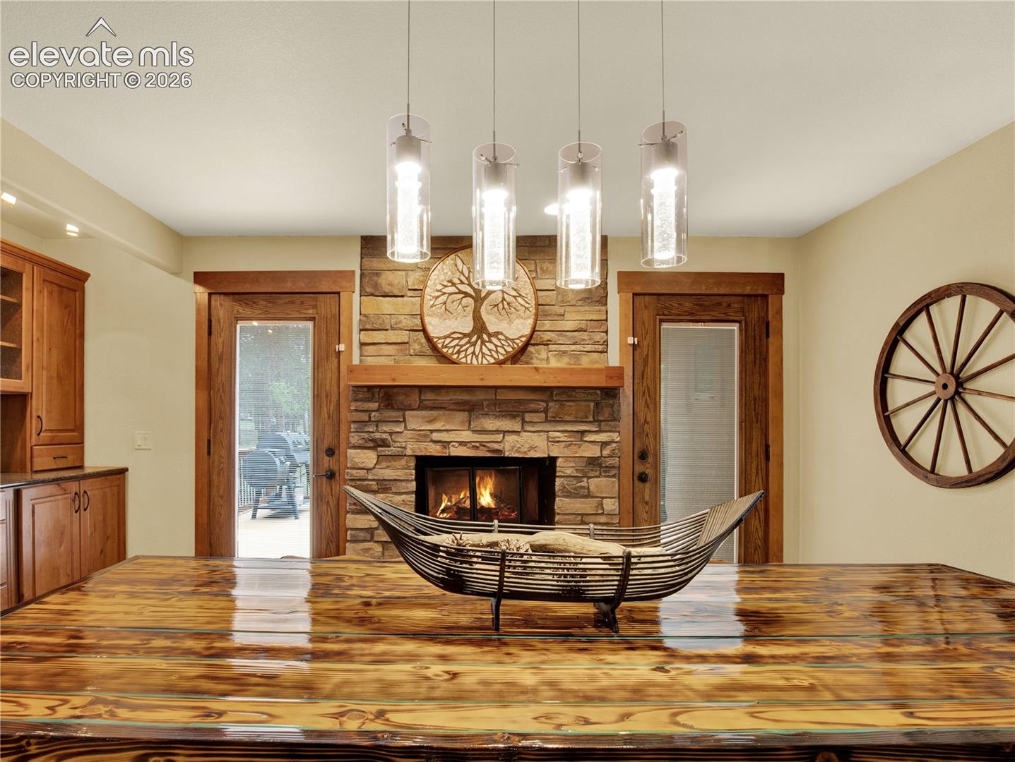 Formal dining room warmed by a wood burning with access to an outside patio