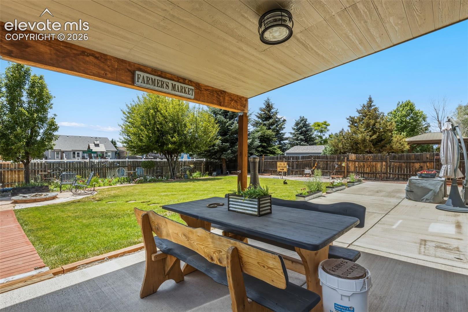 Shaded Outdoor Living Space Overlooking the Backyard