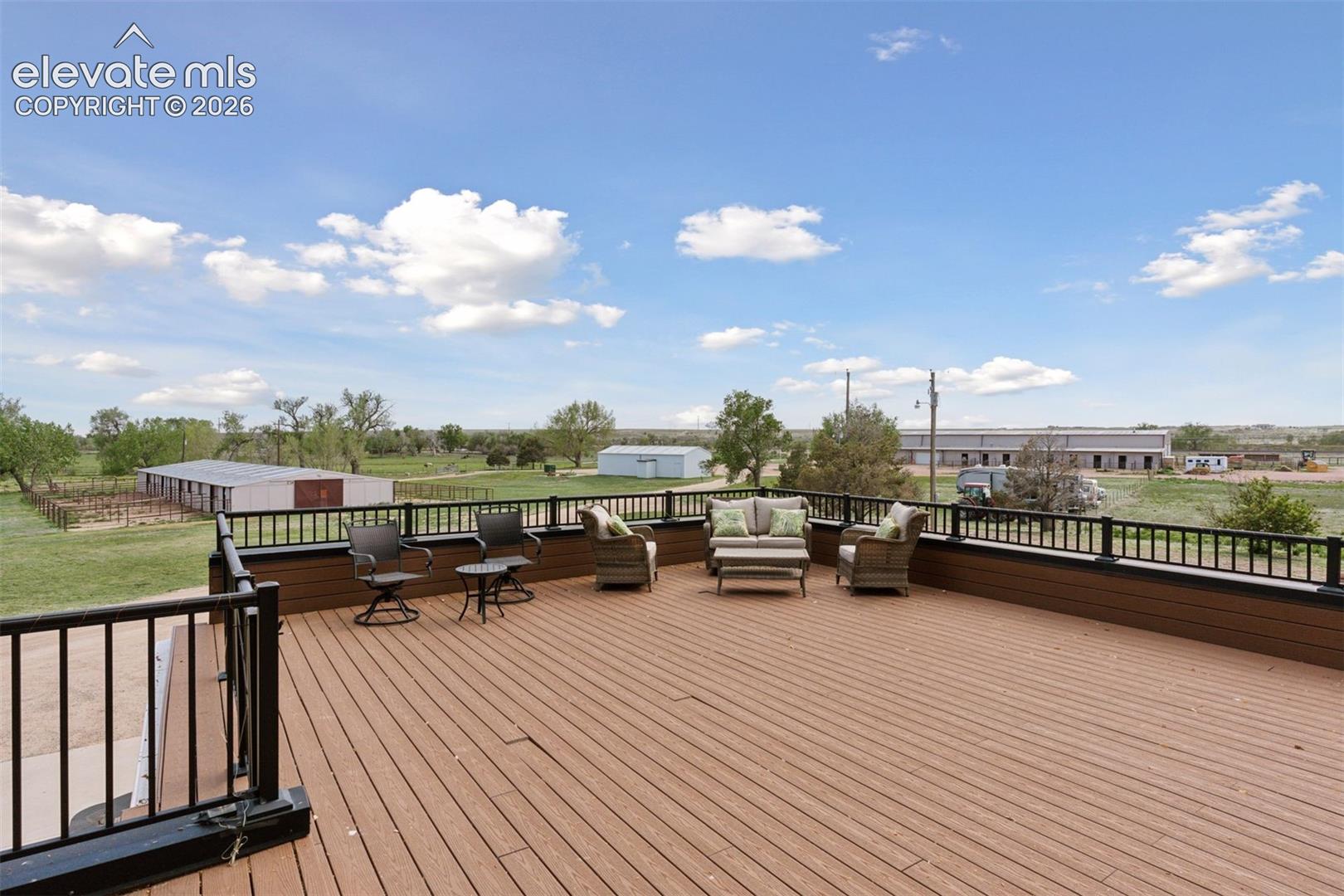 Low maintenance deck off of Primary Suite overlooking facilities(not pictured: hot tub & mountain views)