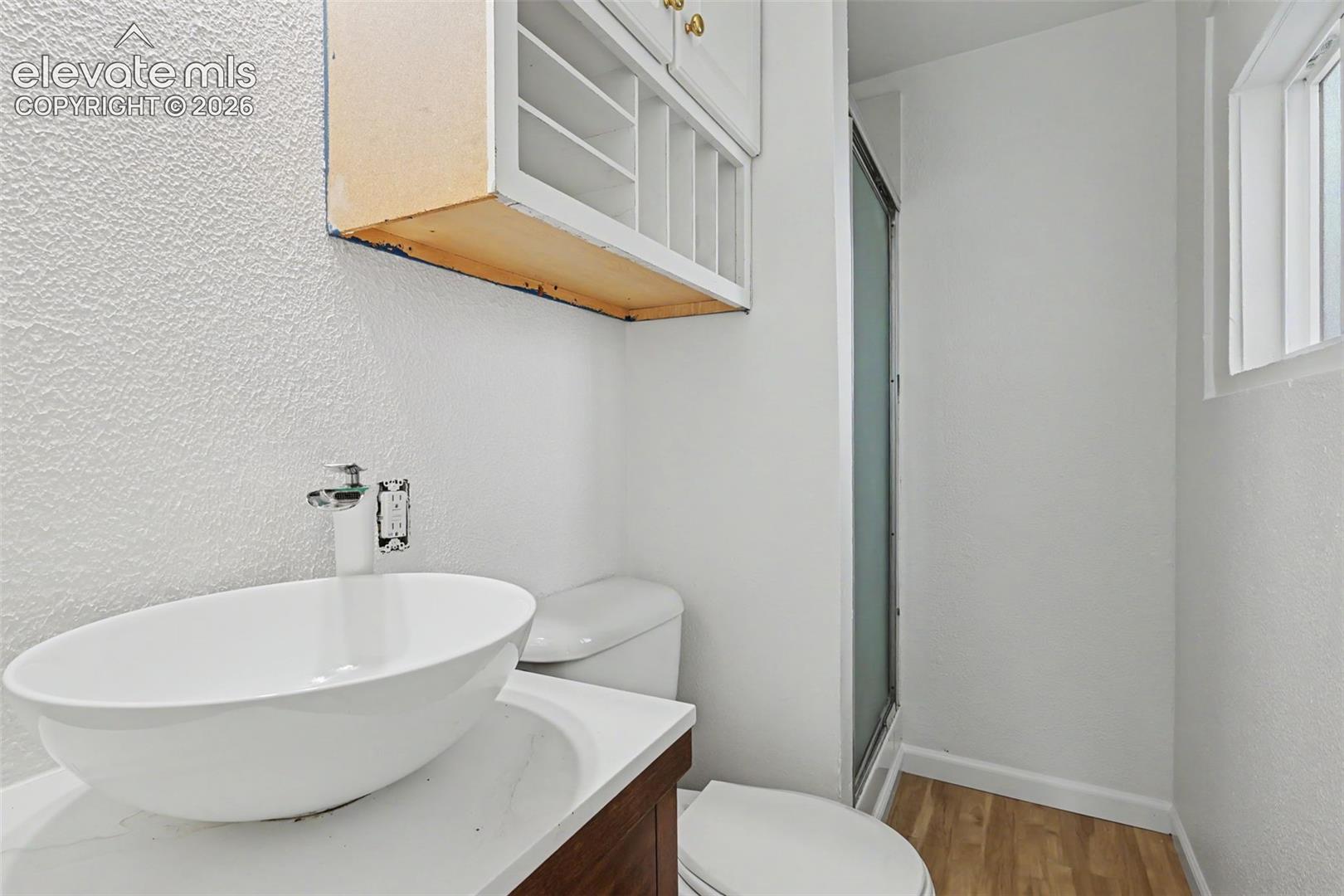 Attached ¾ bathroom with walk in shower and convenient storage