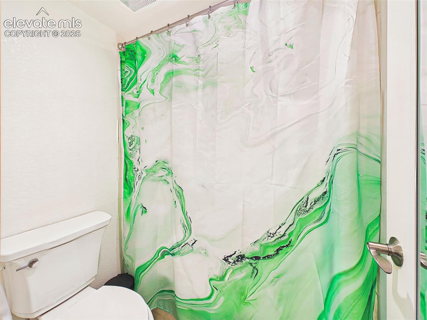 Secondary full bath complete with a shower/tub combination and neutral finishes for everyday convenience.