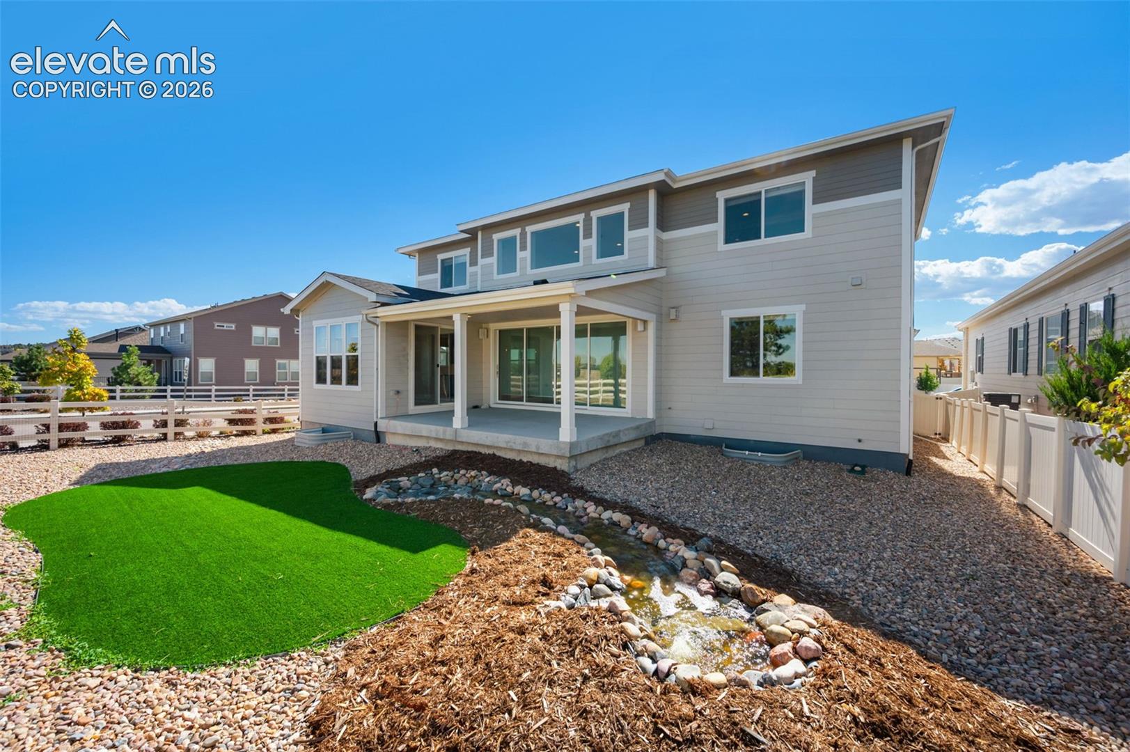 Beautifully Landscaped And Fenced Yard