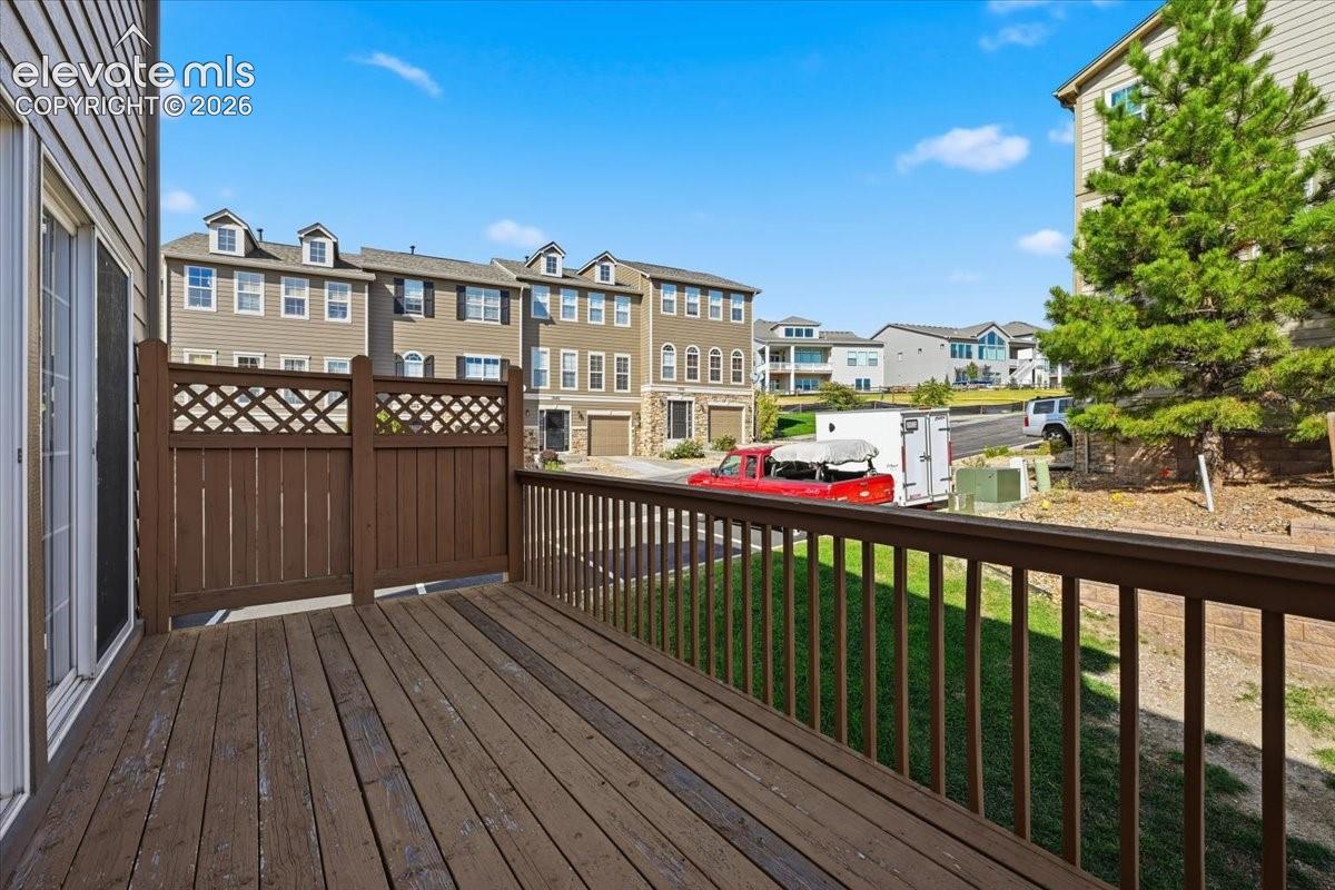 Exterior deck, wood railing, and a privacy screen with lattice detail perfect for outdoor gatherings