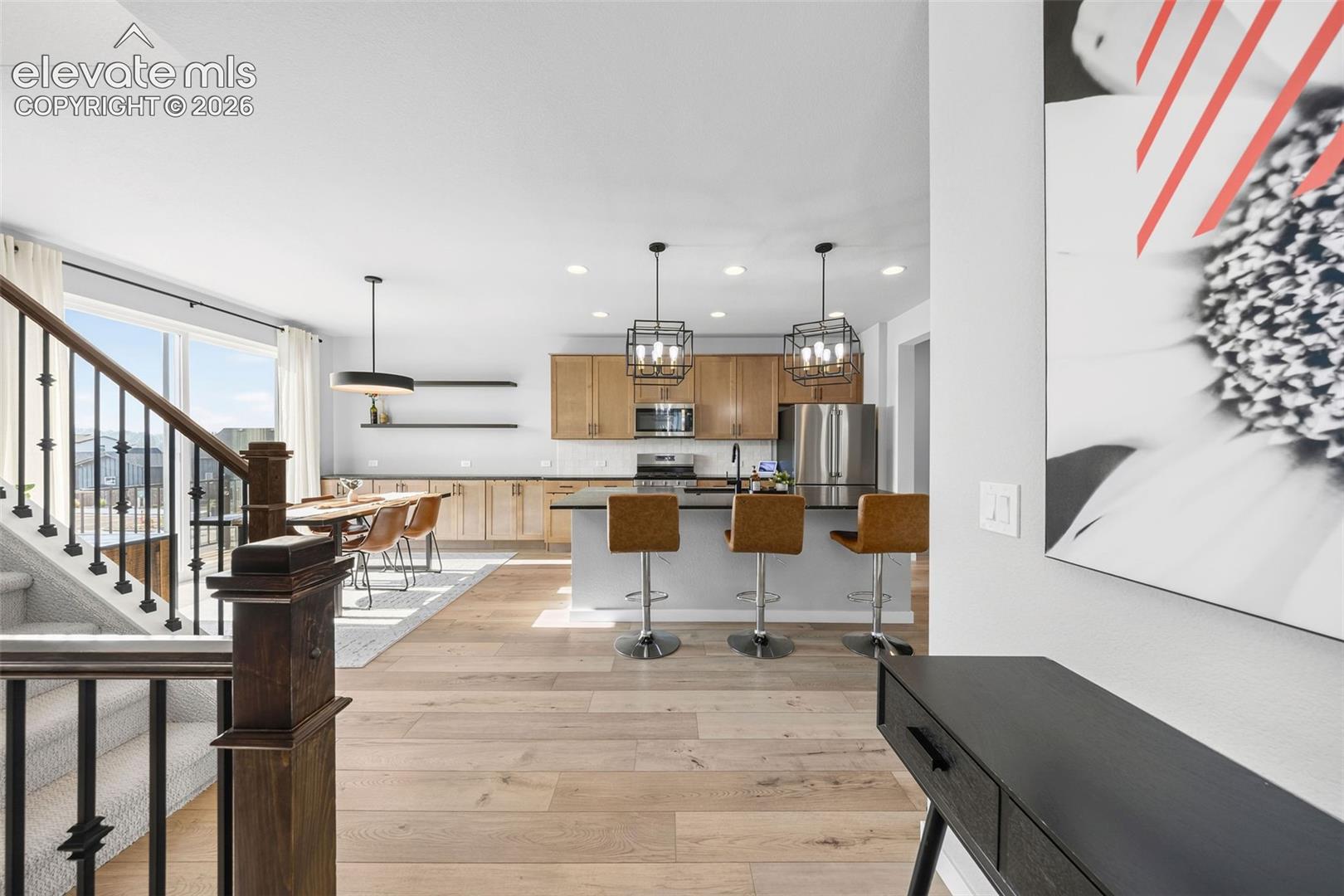 Walking in from the front door takes you to the main floor with the kitchen, dining room, living room, office and powder room. 