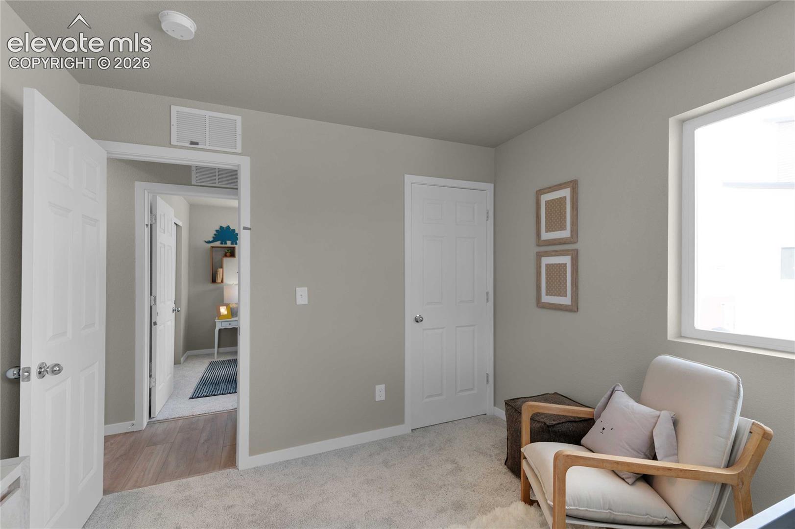 Soft gray wall paint, white trim, and a window with white casing
*photos of a model home*