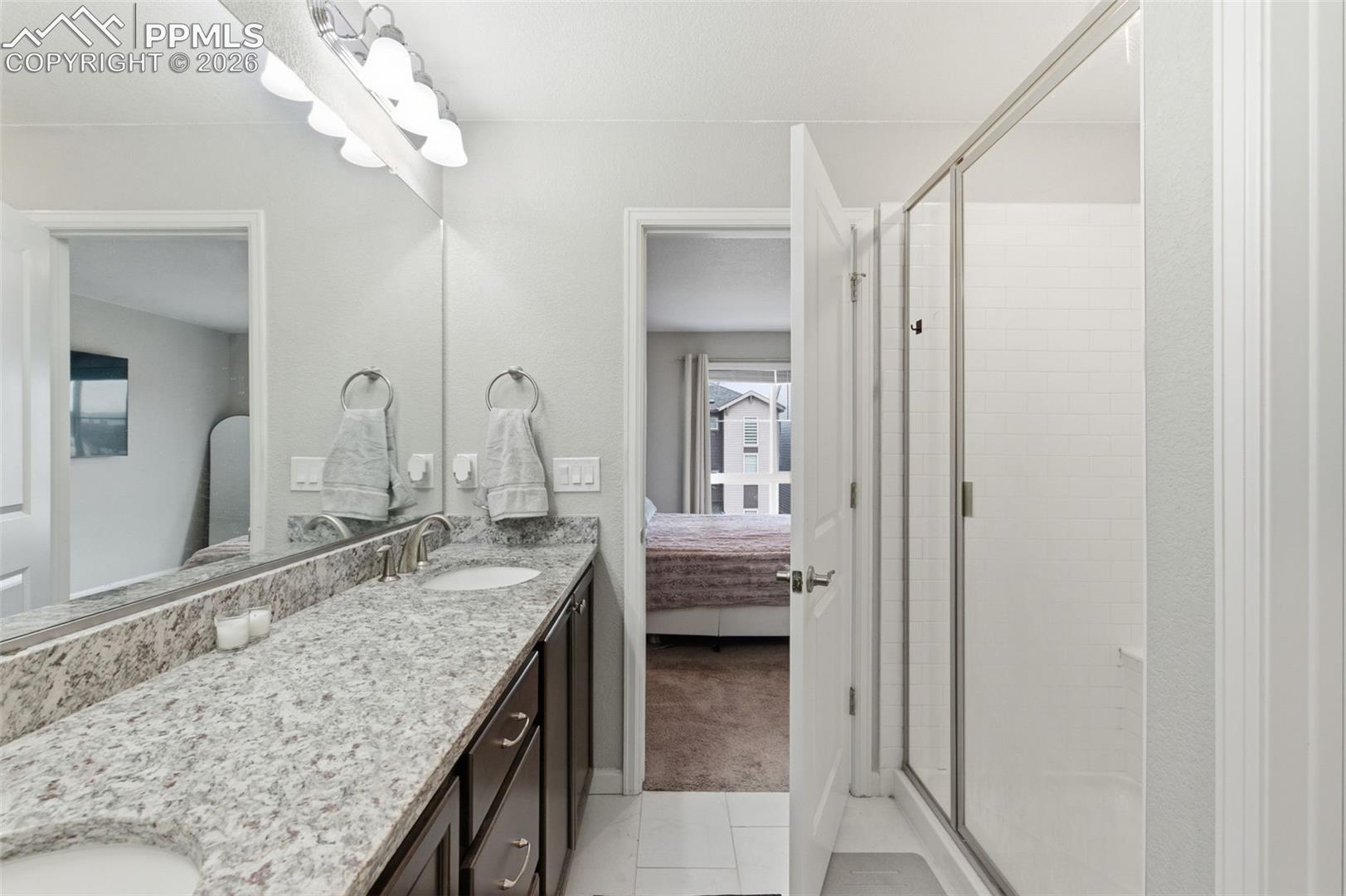 Granite counters & shower is to the right