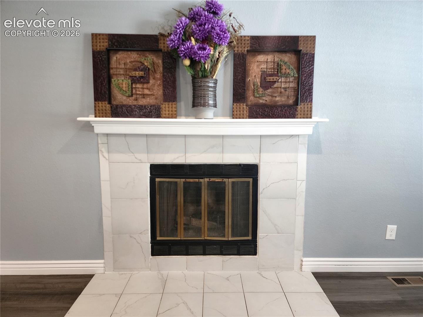 Classic focal-point fireplace complete with a clean, timeless mantel