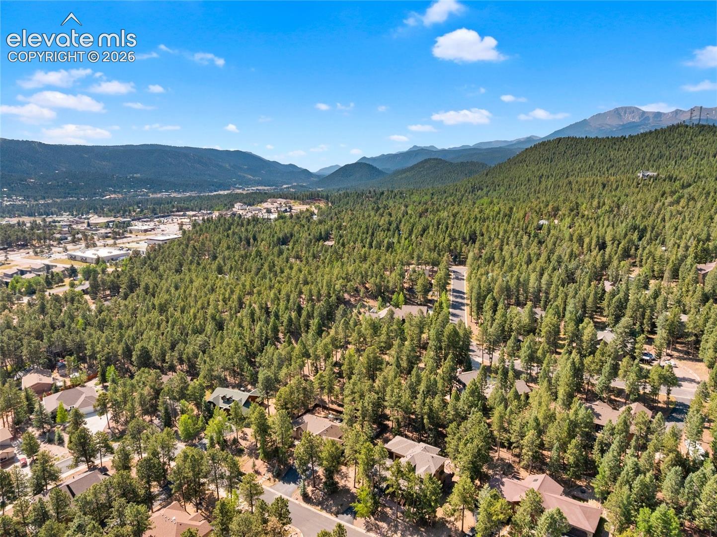 Drone view of neighborhood looking Southeast at Woodland Park.